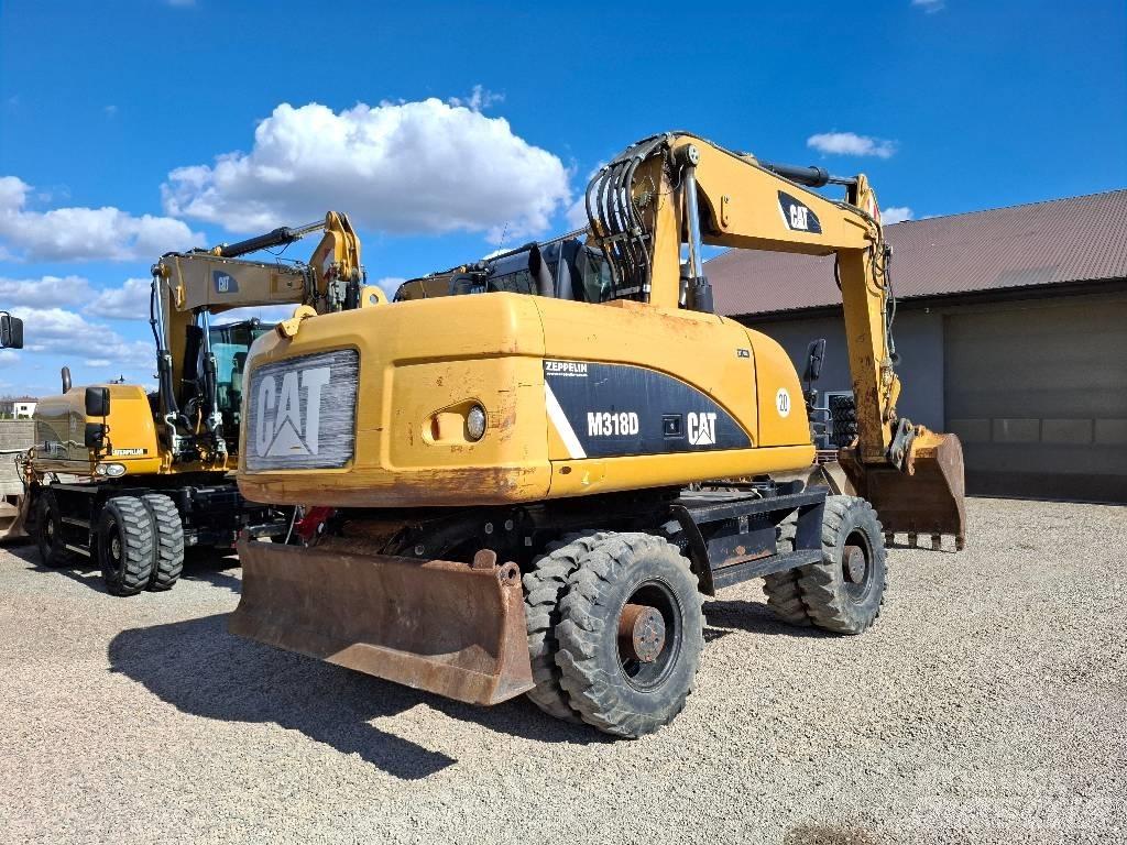 CAT 318 Колёсные экскаваторы