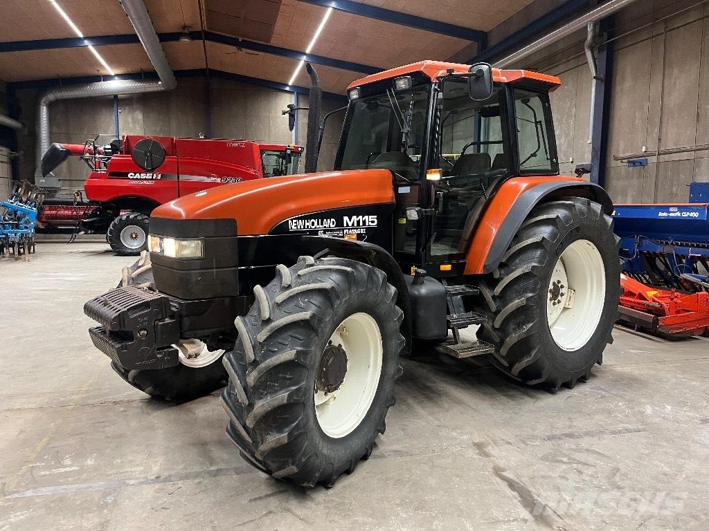 New Holland M 115 Трактора