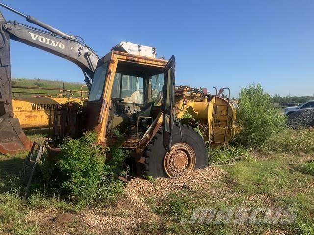 CAT 613C Поливочные машины
