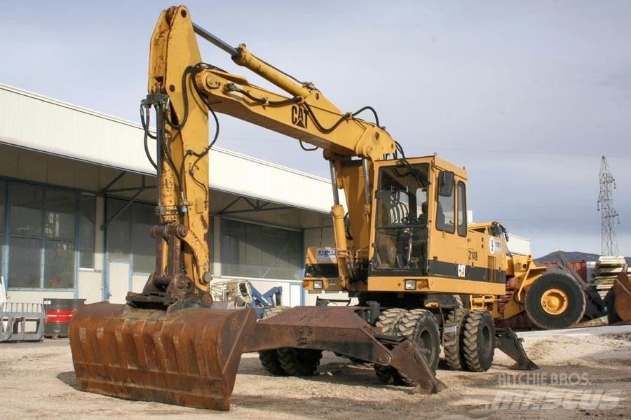 CAT 214B Колёсные экскаваторы