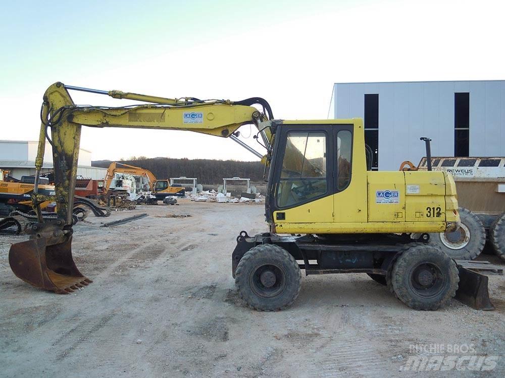 CAT M312 Колёсные экскаваторы