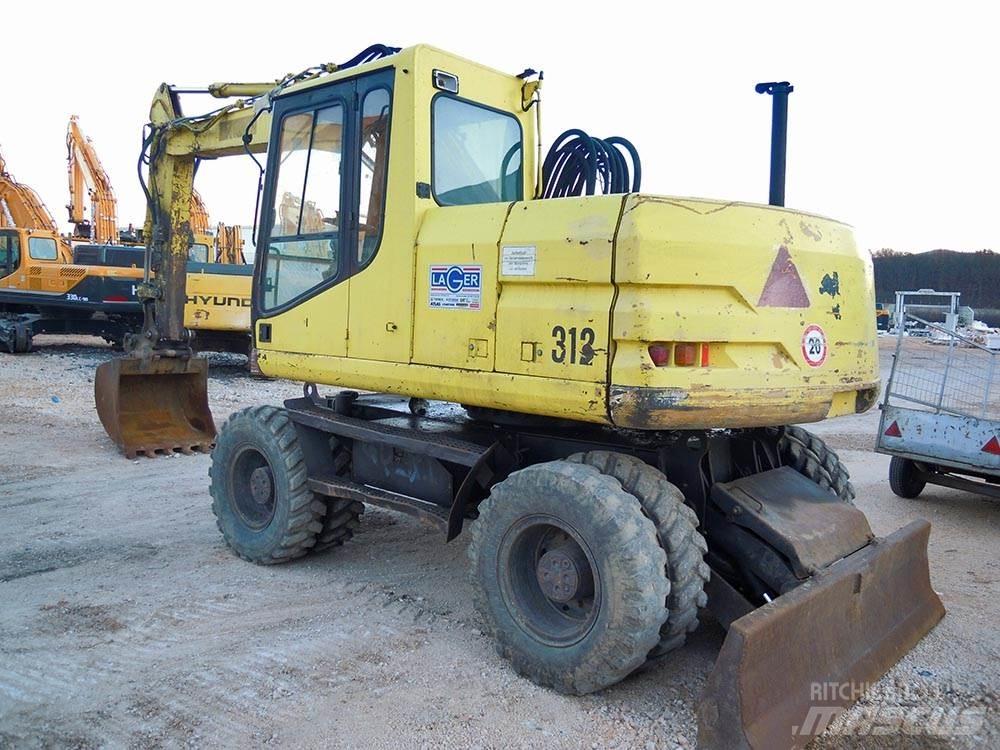 CAT M312 Колёсные экскаваторы