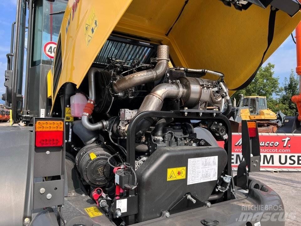 New Holland W110D Фронтальные погрузчики