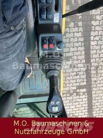 CAT MH 3022 Колёсные экскаваторы