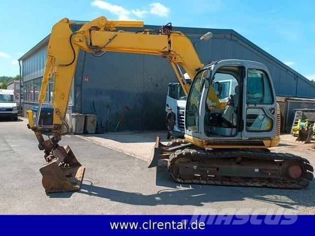 New Holland E70SR 4 Экскаваторы-погрузчики