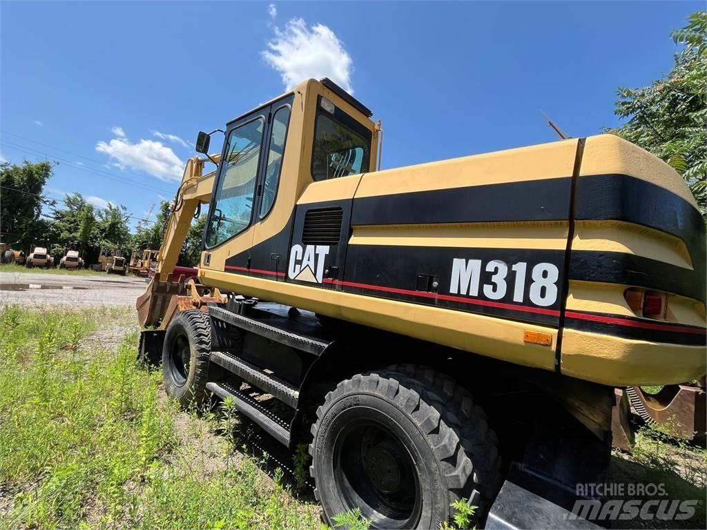 CAT M318 Колёсные экскаваторы