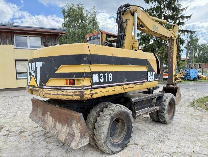 CAT M318 Колёсные экскаваторы