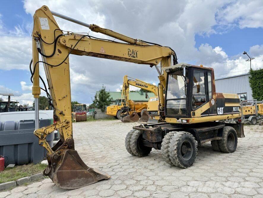 CAT M318 Колёсные экскаваторы